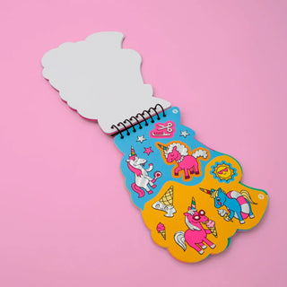Colorful children's book with unicorn illustrations on a pink background