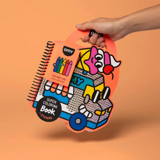 Colorful super coloring book and stickers set held by a hand on an orange background